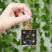 Goldene Schneeflocken auf schwarzem Hintergrund Schlüsselanhänger (Hand)