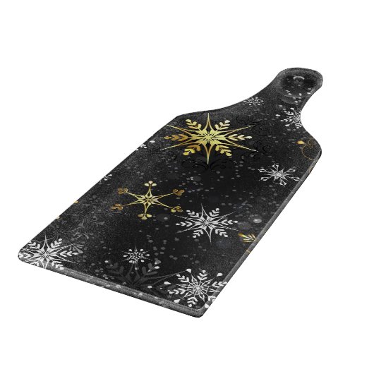 Goldene Schneeflocken auf schwarzem Hintergrund Schneidebrett (Ecke)
