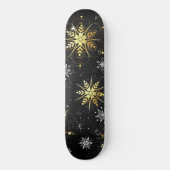 Goldene Schneeflocken auf schwarzem Hintergrund Skateboard (Vorderseite)