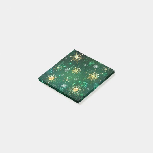 Goldene Schneeflocken im grünen Hintergrund Post-it Klebezettel (angewinkelt)