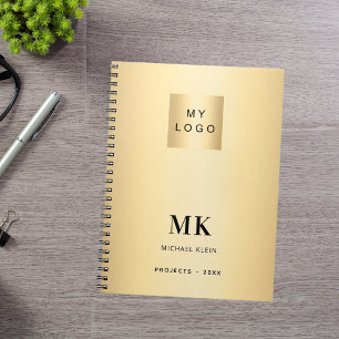 Goldene schwarze Monogramm-Anfangsbuchstaben Gesch Notizblock