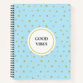 Goldene Sterne auf einem helltürkisblauen Notebook Notizblock (Vorderseite)