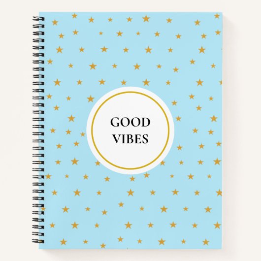 Goldene Sterne auf einem helltürkisblauen Notebook Notizblock (Vorderseite)
