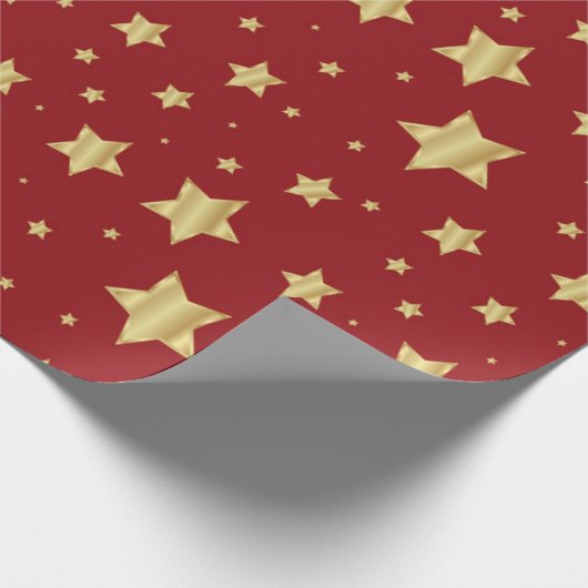 Goldene Sterne auf rotem Hintergrund Geschenkpapier (Ecke)