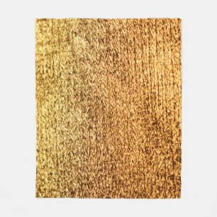 Goldene Textilien: glamouröser Makro-Hintergrund. Fleecedecke