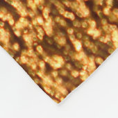 Goldene Textilien: glamouröser Makro-Hintergrund. Fleecedecke (Ecke)