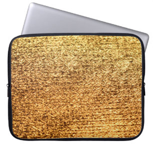 Goldene Textilien: glamouröser Makro-Hintergrund. Laptopschutzhülle