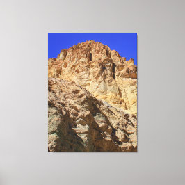 Goldene Wüstenklippe unter blauem Himmel Leinwanddruck