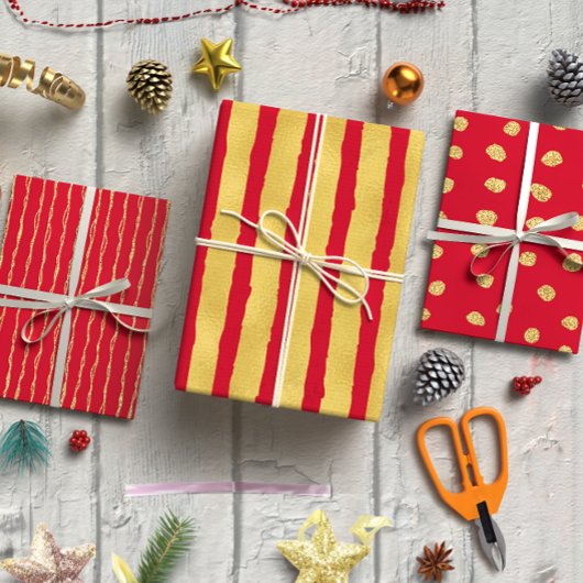 Goldener Glitzer auf dem Set von 3 Weihnachten Geschenkpapier Set