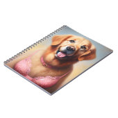 Goldener Retriever mit rosa BH Notizblock (Linke Seite)