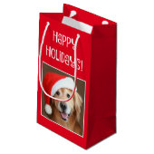 Goldener Retriever mit roter Weihnachtsmannmütze Kleine Geschenktüte (Rückseite Schrägansicht)