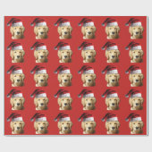 Goldener Retriever mit Weihnachtsmannmütze auf Geschenkpapier (Flach)