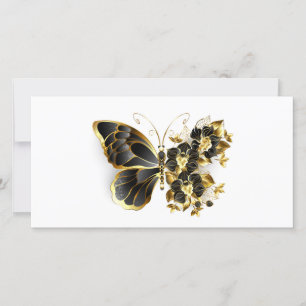 Goldener Schmetterling mit schwarzem Orchid