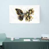 Goldener Schmetterling mit schwarzem Orchid Banner (Messeveranstaltung)