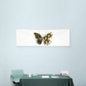 Goldener Schmetterling mit schwarzem Orchid Banner (Messeveranstaltung)