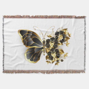 Goldener Schmetterling mit schwarzem Orchid Decke