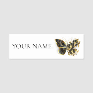 Goldener Schmetterling mit schwarzem Orchid Namensschild