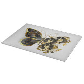 Goldener Schmetterling mit schwarzem Orchid Schneidebrett (Ecke)