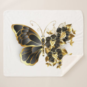 Goldener Schmetterling mit schwarzem Orchid Sherpadecke