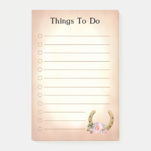 Goldenes Horseshoe mit Blume, was nach dem Ende zu Post-it Klebezettel