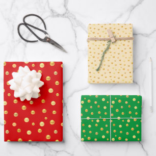 Goldenes Konfetti auf goldenem, grünem und rotem Geschenkpapier Set