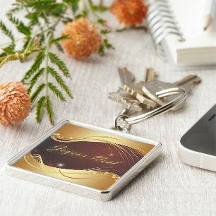 Goldenes Weihnachtsmotiv mit rotem Hintergrund... Schlüsselanhänger