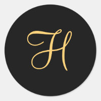 Goldfarbenes H auf schwarzem Monogramm bei gerader