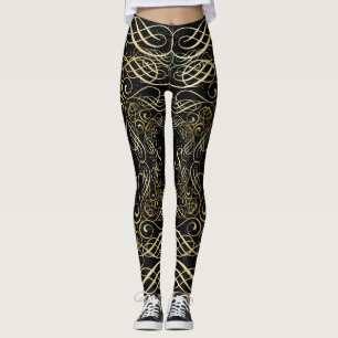 Goldfolien-Blick Scrollwork Skript auf schwarzem Leggings