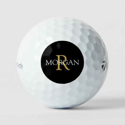 Goldmonogramm und weißer Name auf schwarzem Kreis Golfball (Vorderseite)