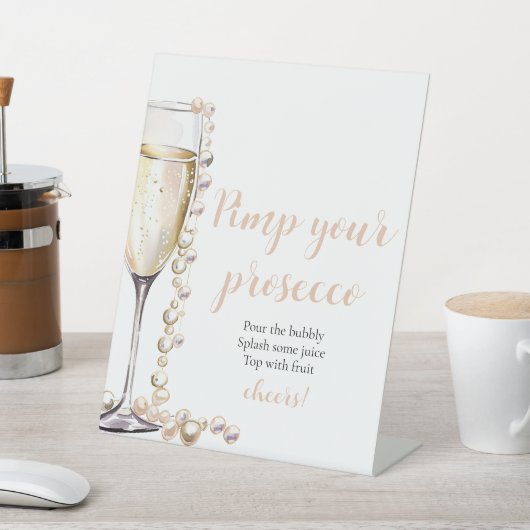 Goldperlen und Prosecco Pimp Ihr Prosecco Mimosa Sockelschild (In SItu)