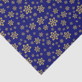 Goldschneeflocken auf blau seidenpapier (Ausschnitt)