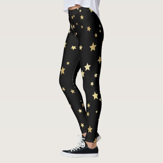 Goldsterne auf schwarzem Hintergrund Leggings (Links)