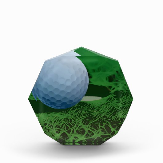 Golf Ball auf dem Grünen Fotoblock (Vorderseite)