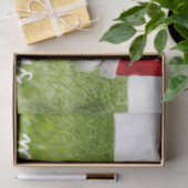 Golf-Ball mit dem Weihnachtsmann-Hut auf grünen We Seidenpapier (Geschenk)