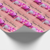 Golf-Ball mit rosa Polka-Punktband in rosa Geschenkpapier (Ecke)