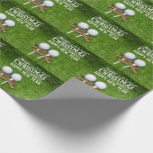 Golf Bälle Weihnachtstee mit Bänkchenmütze auf Grü Geschenkpapier (Ecke)