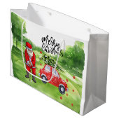 Golf Weihnachtsbaum auf rotem Auto mit dem Weihnac Große Geschenktüte (Vorderseite Schrägansicht)