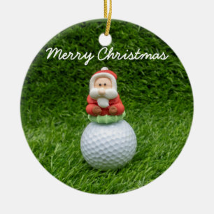 Golfball Der Weihnachtsmann ist auf grünem Gras W Keramik Ornament
