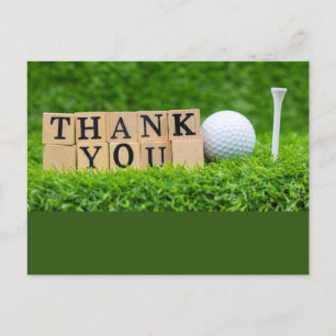 Golfball mit Dankeschön Wort auf grünem Gras Postkarte