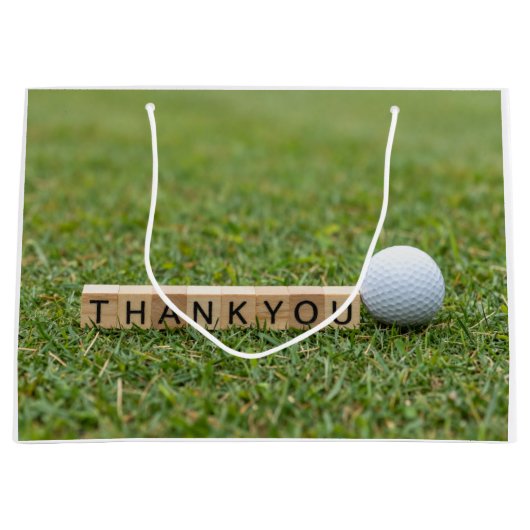 Golfball mit dem Text Danke auf grünem Gras Große Geschenktüte (Vorderseite)