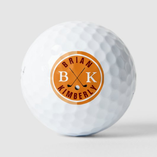 Golfball mit Golfernamen und orangefarbenen Initia (Vorderseite)