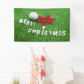 Golfball mit Weihnachtsgeschmack auf grünem Gras Banner (Insitu)