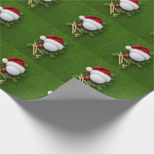 Golfball trägt Weihnachtsmannmütze zu Weihnachten Geschenkpapier