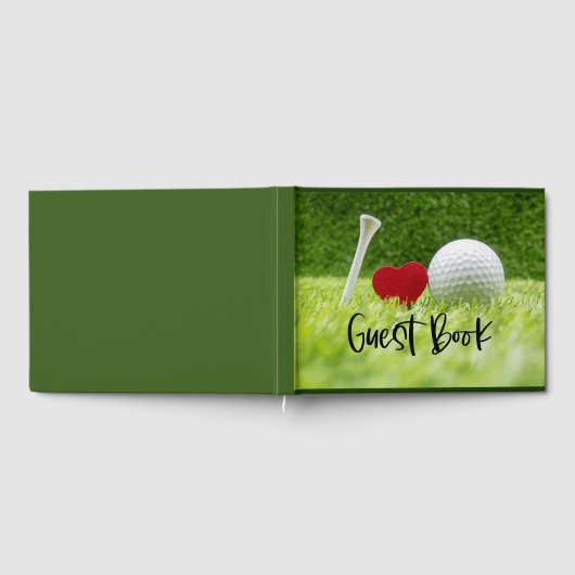 Golfball und Abschlag auf grünem Gras mit Liebe Gästebuch (Voll)