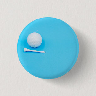 Golfball und Tee auf blauem Grund Button