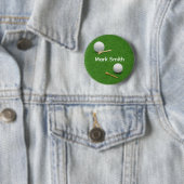 Golfball und Tee auf grünem Gras Knopf Button (Beispiel)