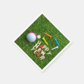 Golfball und Tee mit Happy New Year auf grün Serviette (Ecke)