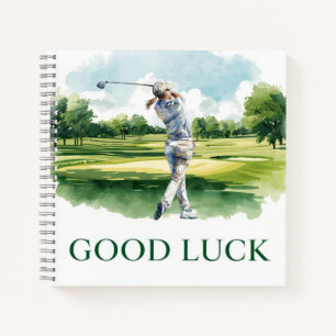 Golfspieler auf Fairway mit Text Viel Glück Notizblock