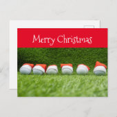 Golfurlaub mit Weihnachtsmannmütze auf Grün Feiertagspostkarte (Vorne/Hinten)