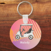 Golfwagen auf rosa farbigem Hintergrund mit Namen Schlüsselanhänger (Vorderseite)